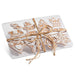The 4.75" Box of Gingerbread Ornaments 4416141 features festive cookies with white icing, packed in a clear plastic box and tied with rustic brown twine—an ideal addition to your Holiday Collection.