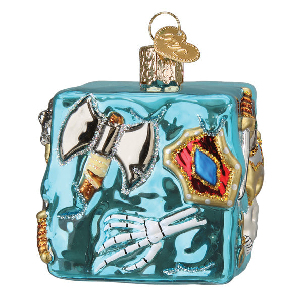 A light blue glass Dungeons and Dragons Gelatinous Old World Christmas Ornament 44230 featuring a skeleton hand, a silver battle axe, and a shield embedded in the surface.