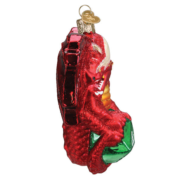 Dungeons and Dragons Red Dragon Old World Christmas Ornament 44231 featuring a red dragon clutching a green d20 die.