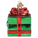 Dungeons and Dragons Holiday Mimic Old World Christmas Ornament 44232 shaped like a green gift box with a red bow, featuring a pair of eyes peeking out from the side.