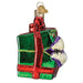 Dungeons and Dragons Holiday Mimic Old World Christmas Ornament 44232, a glass ornament shaped like a green gift box with a red ribbon, featuring a wide mouth with sharp teeth on one side.