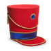 The 11.5" Nutcracker Hat Tree Topper 4516702 from the Christmas Shoppe Collection features a tall, bright red polyester hat with flat top, gold cord, blue glitter band, gold tassel, and a large blue jewel with gold sunburst on the front.