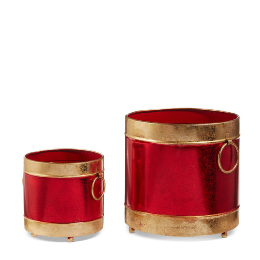 The 8" Red and Gold Containers 4525965 by Raz are metal sheet cylinders of different sizes with gold rims, bases, and decorative rings, creating festive Christmas decor against a white background.