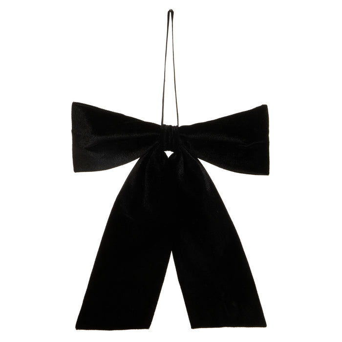Introducing the 12.5″ Black Velvet Bow Ornament (RAZ 4631124): A large, ready-made velvet bow in black with long, trailing tails and attached to a thin hanging loop—perfect for elegant Christmas décor. Shown here against a plain white background.