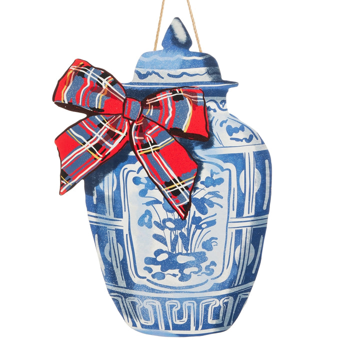 Adorn your home this season with the 19.5″ Blue Chinoiserie Ginger Jar Christmas Door Hanger, featuring intricate blue and white floral designs and topped with a festive red plaid bow—perfect for your door and part of the RAZ Home for the Holidays collection (RAZ 4636578).