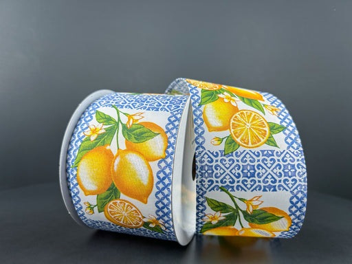 The 2.5X10Y Blue Tile Squares Satin/Lemons Ribbon 46409-40-05 features satin ribbons with lemon and leaf patterns against a dark backdrop, complemented by lemons and orange slices set on blue tile squares for an elegant geometric touch.