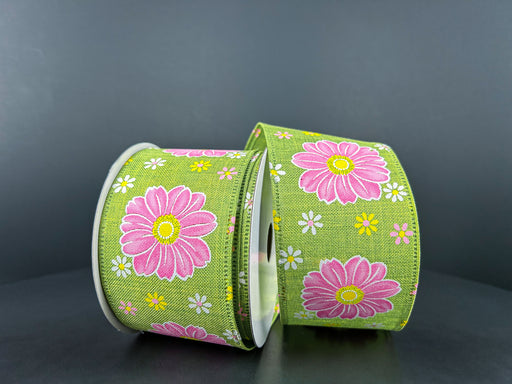 In the image, two rolls of the 2.5"X10Y Lime Linen/Giant Daisies Ribbon 46412-40-09 are displayed upright against a dark gray background, showcasing their vibrant green hue adorned with bold pink flowers and smaller white and yellow blooms that add charm to these wired ribbons.