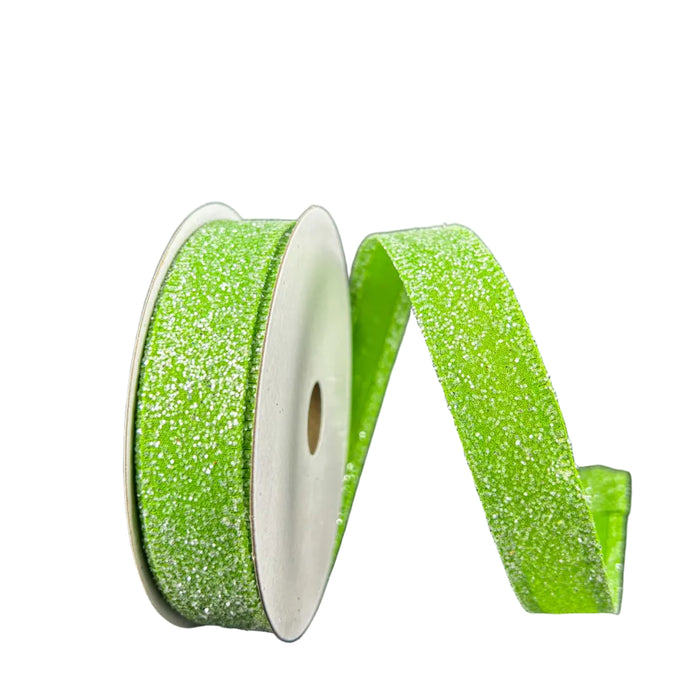 Two spools of 7/8X10Y Lime Candy Glittered Satin Ribbon 46420-05-09, one upright and one lying on a dark gray background. The sparkly ribbon with glittery texture and satin finish is partially unrolled, forming a gentle wave.