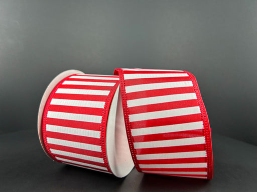 The Red Satin-White Stripes/Lm Edge (2.5X10Y, 46425-40-12) ribbon features eye-catching red and white horizontal stripes on a dark background, with a solid red edge visible as it unrolls.