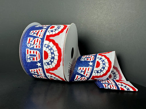 The 2.5X10Y White Linen/Patriotic Pleated Fan Flags Ribbon (46501-40-01) features USA text and red, white, and blue designs with stars and semi-circles on a black background. Ideal for crafting decor or adding flair to projects with Wired 2.5X10Y ribbons.