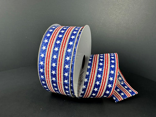 The 1.5X10Y Natural Linen/Royal Glitter Stars With Red Stripes Ribbon (46503-09-25) features glitter stars on a blue backdrop, accented by red and white striped edges.
