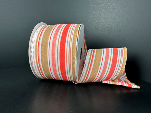A 2.5X10Y Melon Tan ribbon with varied striation stripes is unrolling against a dark background.