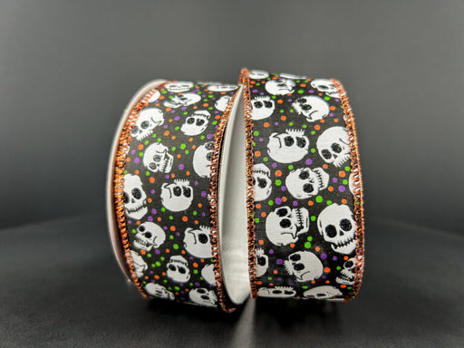 Two 1.5X10Y black satin ribbons, each adorned with white skulls, colorful dots, and edge-accented in orange stitching, are arranged against a dark background.
