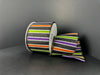 The 2.5X10Y Black Glitter Satin Ribbon features purple, lime, orange, and white horizontal stripes on a black background (51510-40-21), shown against a plain dark backdrop.