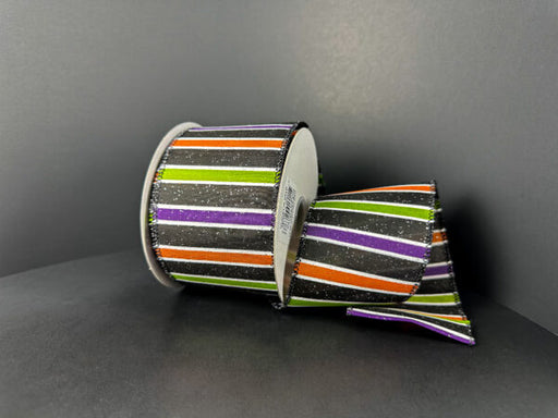 The 2.5X10Y Black Glitter Satin Ribbon features purple, lime, orange, and white horizontal stripes on a black background (51510-40-21), shown against a plain dark backdrop.
