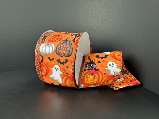 The 2.5X10Y Orange Satin/Vintage Halloween Ribbon 51519-40-19, decorated with ghosts, pumpkins, bats, black cats, and stars, is displayed against a plain dark background.