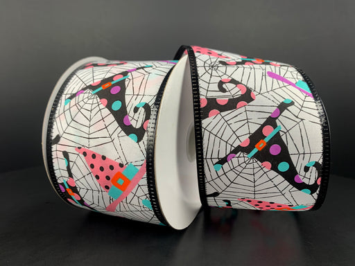 The 2.5X10Y White Satin with Cobweb and Witch Hats 55315-40-03 ribbon features vibrant polka dot patterns in pink, teal, and other bright colors on a white satin backdrop with cobwebs, perfectly complementing its dark design accents.