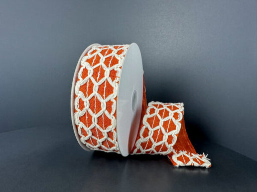 A roll of 1.5X10Y Ivory Black Ivory Scallop Burlap/Rust Linen Ribbon (61520-09-31) is shown against a dark background, partially unspooled and draped to the side.
