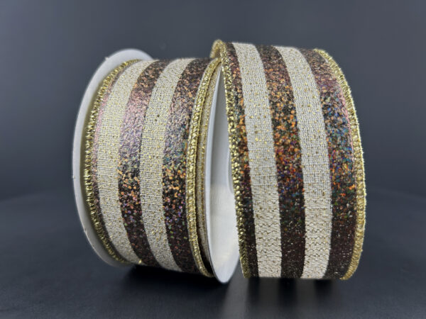 Two rolls of 1.5X10Y Chocolate Natural Gold Woven Metallic Stripe Ribbon (68456-09-38) are shown against a dark background, featuring glittery brown and textured cream stripes with shiny gold-edged borders.