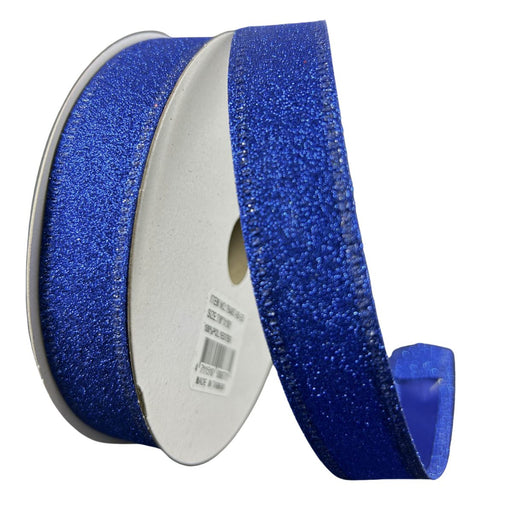 A spool of 7/8" royal blue ribbon with flat glitter texture and wired edges, shown partially unrolled to highlight its sparkle and structure.