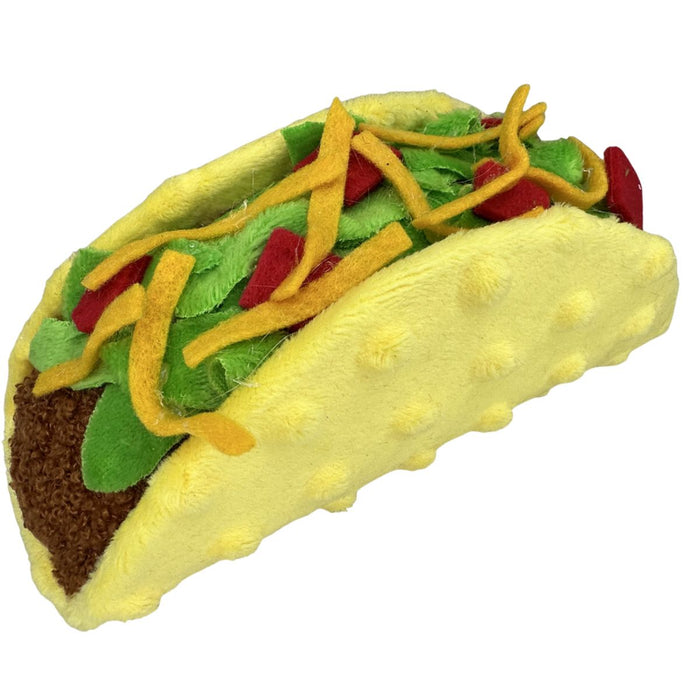 Soft plush taco decor with yellow shell, green lettuce, red tomato, and yellow cheese details, 7 inches long.