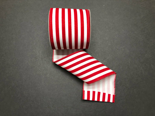 The 4"X10Y White/Red Glitter Flocked Cabana Stripe ribbon (product code 71212-04-12) is unfurled against a dark background, showcasing its wired design and glossy, textured appearance.