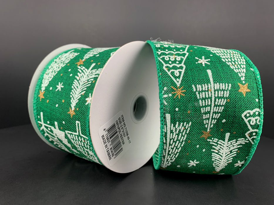 Two spools of 2.5X10Y emerald linen ribbon with white Christmas trees, gold stars, and white dots are set against a dark background. The partially unwound wired ribbon showcases its festive design, while a label with a barcode is visible on one spool.