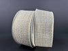 Two rolls of 1.5X10Y Ivory-Gold-Gold Metallic Tweed Ribbon 72414-09-18, featuring a woven ivory gold look and shimmery finish, rest slightly overlapping against a dark background.