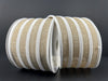 Two rolls of 2.5 x 10yd Natural Linen/White Flocked Cabana Stripe Ribbon (72416-40-15), featuring bold tan and white stripes with crisp white edges, are displayed side by side on a dark background.