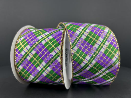 Two upright spools of wired ribbon against a dark background feature the 2.5X10Y White Linen/Emerald-Purple-Gold Busy Plaid 72424-40-01 pattern with gold-trimmed edges and white cores, adding an elegant touch.
