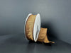 A spool of 7/8X10Y Brown Faux Dupioni Ribbon (72434-05-38) with a subtle sheen sits upright, partially unrolled, against a plain dark background.