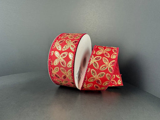 A 1.5X10Y Red Satin/Red-Gold Glitter Petals Ribbon (73509-09-13) with sparkling gold and green leaf designs is shown partially unrolled on a plain gray background.
