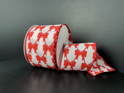 The 2.5x10Y White Ponche Satin/Red Bows Ribbon (73543-40-12) features red satin bows on white, creating a striking decorative accent when displayed against dark surfaces.
