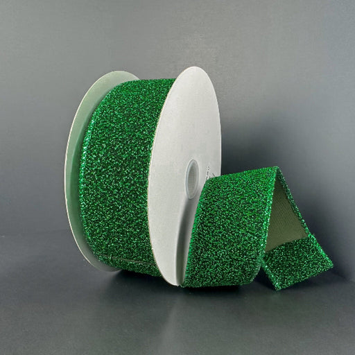 A partially unrolled 1.5X10Y Emerald-Black Fuzzy Metallic Ribbon (73566-09-17) is displayed against a plain gray background.