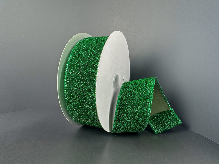 A partially unrolled 1.5X10Y Emerald-Black Fuzzy Metallic Ribbon (73566-09-17) is displayed against a plain gray background.