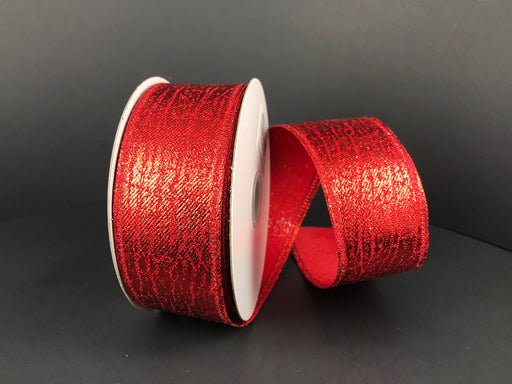 Two spools of 1.5X10Y Red Crackle Lame Ribbon 75206-09-12 are set on a plain black background—one upright, the other leaning forward with shiny red ribbon partially unspooled and curved, showing the textured pattern.