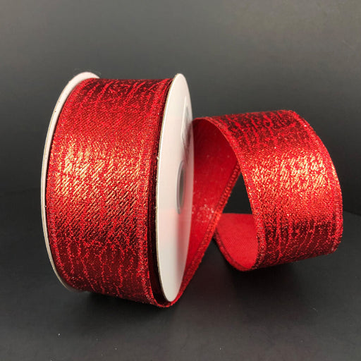 Two spools of 1.5X10Y Red Crackle Lame Ribbon 75206-09-12 are set on a plain black background—one upright, the other leaning forward with shiny red ribbon partially unspooled and curved, showing the textured pattern.