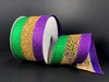 A 2.5x10Y Gold Purple Green Glitter Net Ribbon (75245-40-01) with gold and purple-green glitter edges is partially unrolled, showcasing its shiny, textured surface against a dark background.