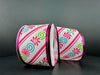 Two spools of the 2.5X10Y White Linen/Christmas Candy-Fuchsia-White Diagonal Stripe-Fuchsia Metallic Edge Ribbon 76307-40-44 stand against a dark background, featuring pink, blue, and green swirl candies on white with shiny metallic pink edges.