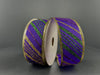 Two spools of 1.5X10Y Purple Satin/Gold-Emerald Glitter Diagonal Stripe Ribbon (76465-09-11) with sparkling gold edges are displayed upright against a plain dark background.