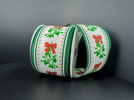 Two rolls of 2.5x10Y Ivory Linen/Mistletoe Bow/Green Edge Ribbon (76502-40-07) are displayed on a dark gray surface with a gray background.