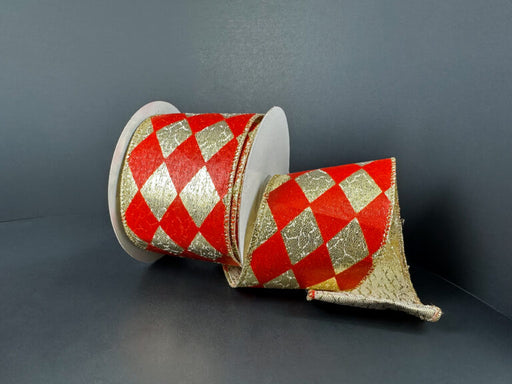 A 2.5X10Y Gold Metallic/Red Harlequin Ribbon 78513-40-13 with a bold diamond pattern is partially unrolled against a dark background.