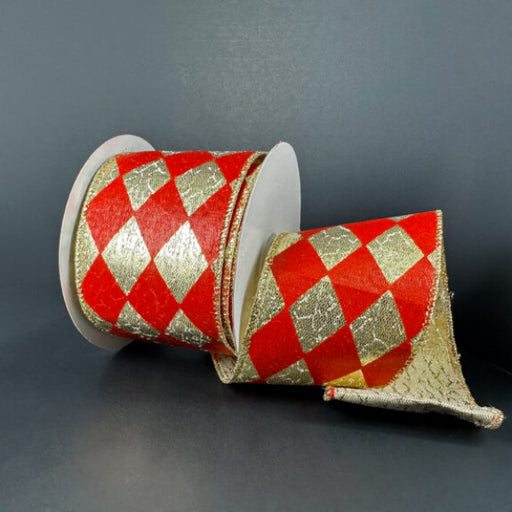 A 2.5X10Y Gold Metallic/Red Harlequin Ribbon 78513-40-13 with a bold diamond pattern is partially unrolled against a dark background.