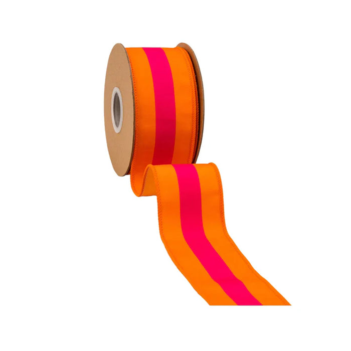 The 2.5 Inch Pink on Orange Center Stripe with Orange Backing Ribbon (8217W-750-63E) features a bold pink stripe down the center of bright orange ribbon with finished edges, shown unrolled against a white background.