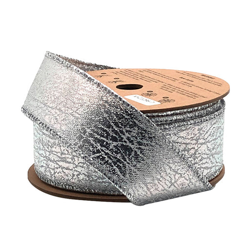 A spool of 1.5" Silver Faux Leather Ribbon (WR-10189-038-10) with a metallic texture, partially unrolled on a brown cardboard reel.