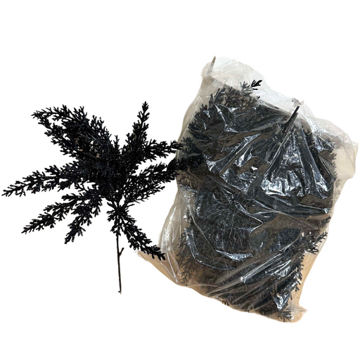 The 14 Black Lavender Pick with Glitter (84786-BK) features artificial black foliage with a subtle glitter sheen. The transparent plastic bag it comes in is filled with sparkly, twig-like branches that add an elegant, mystical touch reminiscent of dark lavender.