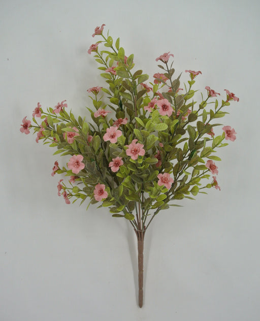The 16 Mauve Filler Bush (9 Stems, 85152-MV) features artificial green leaves and mauve pink flowers with small blossoms, arranged against a plain white background.