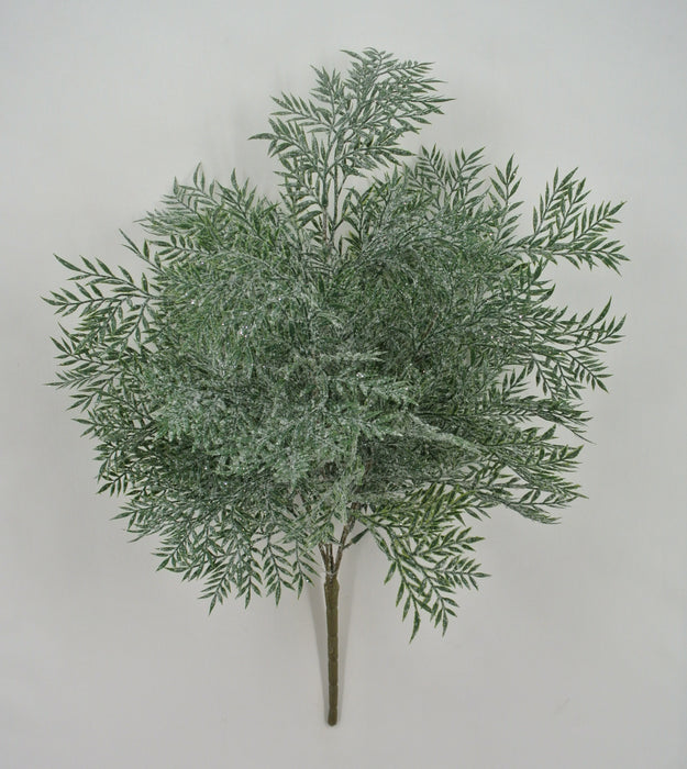 The 21" Plastic Leaf with Iced Bush Spray 85257 features artificial green fern-like leaves with a snowy white dusting, displayed against a plain white background.