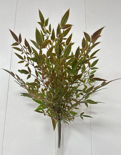 The 22 Green Plastic Leaf Bush 85365-UV features many slender green leaves with reddish stems, displayed against a plain white background—ideal for adding low-maintenance artificial greenery to any setting.