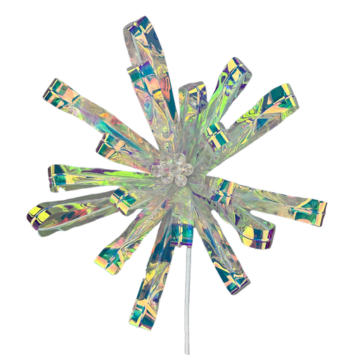 Introducing the 24" by 10" Flower Stem 86064IRDS: This ornament features a shimmering, iridescent star shape adorned with a central cluster of sparkling gems. Its elongated, translucent petals are symmetrically arranged like those of a flower stem, displaying a stunning rainbow-like pattern. The ornament is elegantly attached to a thin metallic stem.